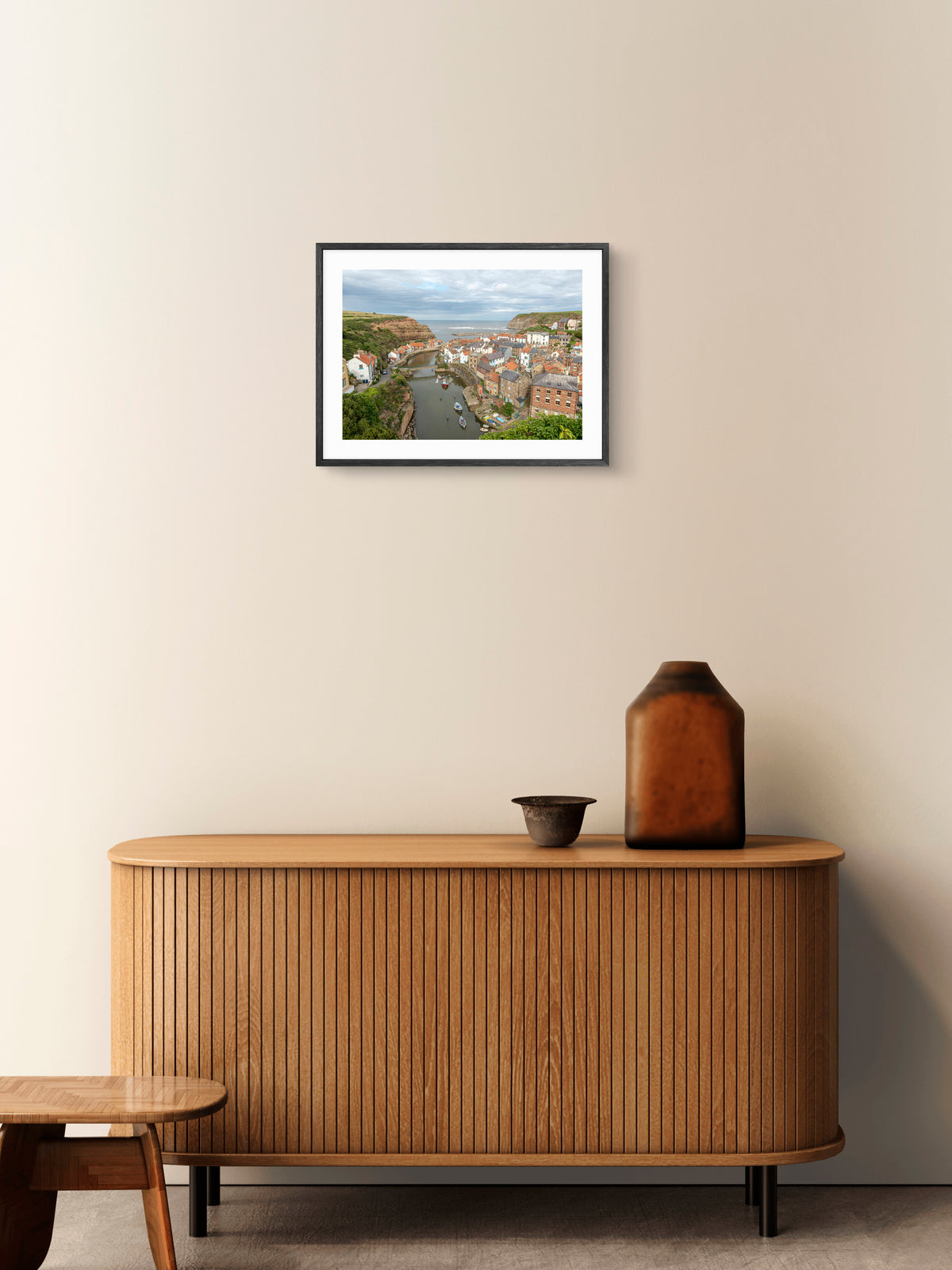 Staithes - Fishing Village - North Yorkshire wall art displayed in a styled room setting.