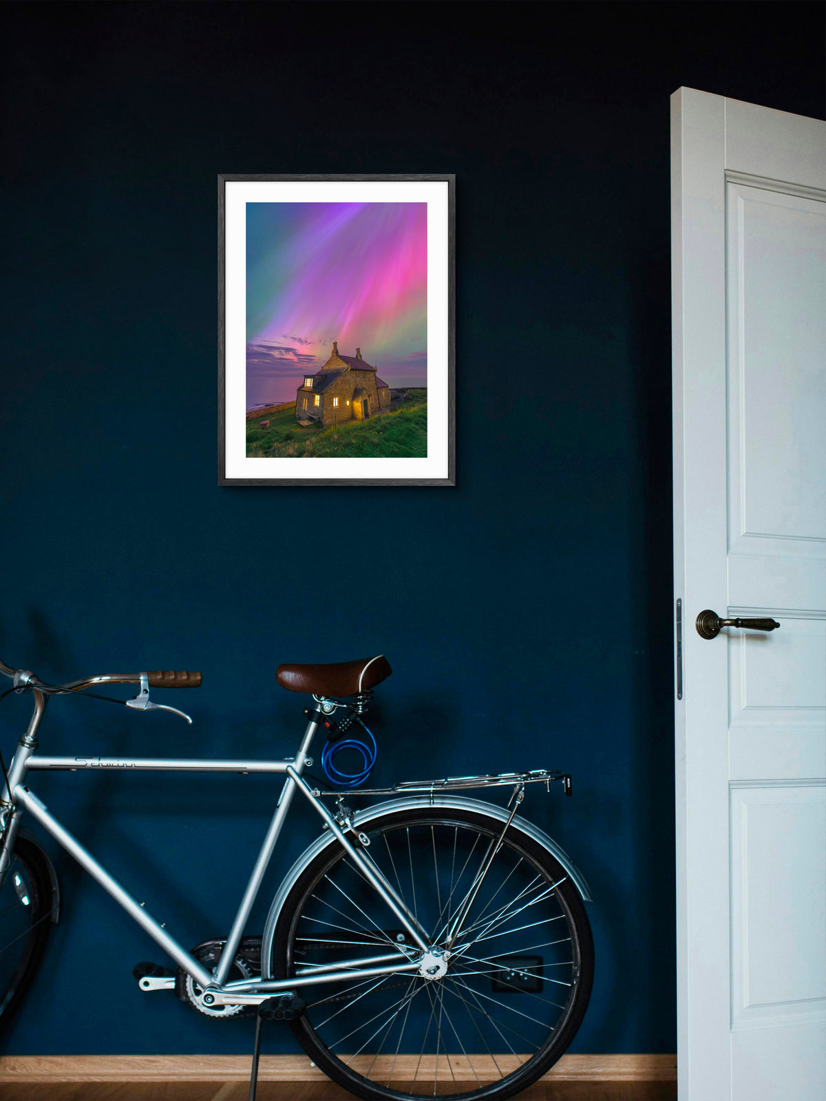 The Bathing House - Northern Lights - Craster - Northumberland wall art displayed in a styled room setting.