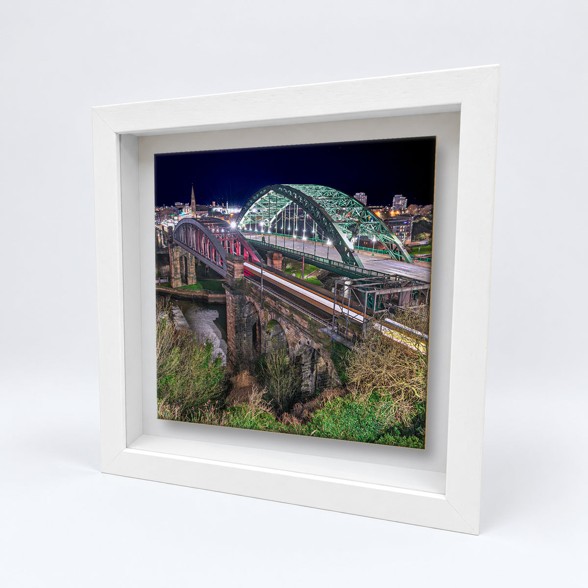 Wearmouth Bridge at Night on an 8×8 inch ceramic tile in a white box frame, angled view