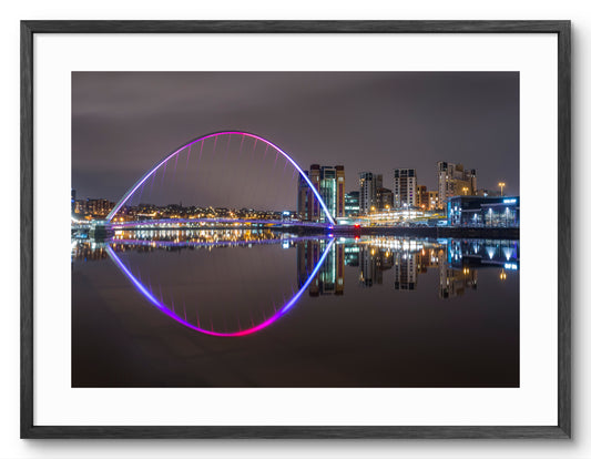 Millennium Bridge Gateshead - Illuminated at Night - Gateshead shown as a framed photographic print.