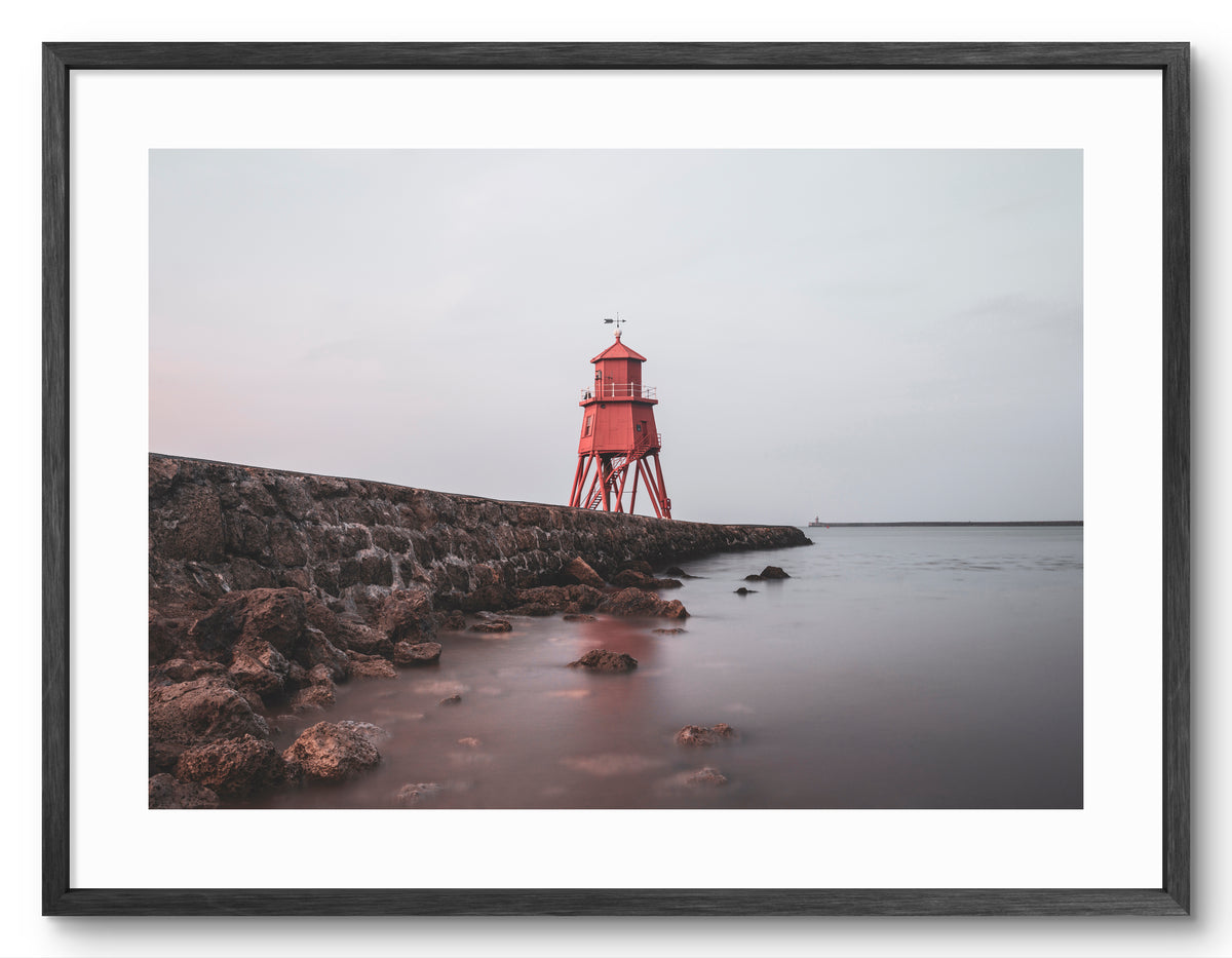 Herd Groyne Lighthouse - Reflecting on Water - South Shields shown as a framed photographic print.
