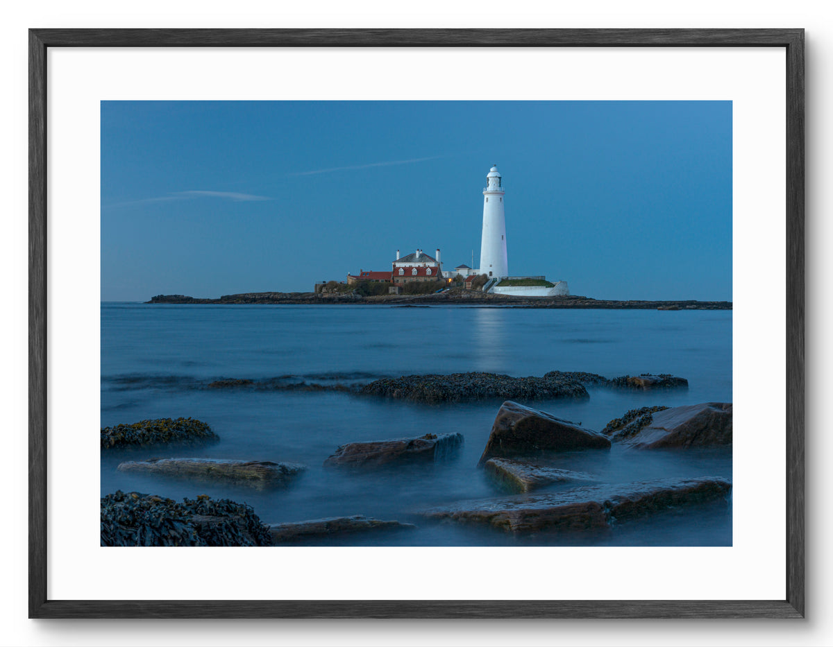 St Mary's Lighthouse and Rocks - Blue Hour - Whitley Bay shown as a framed photographic print.