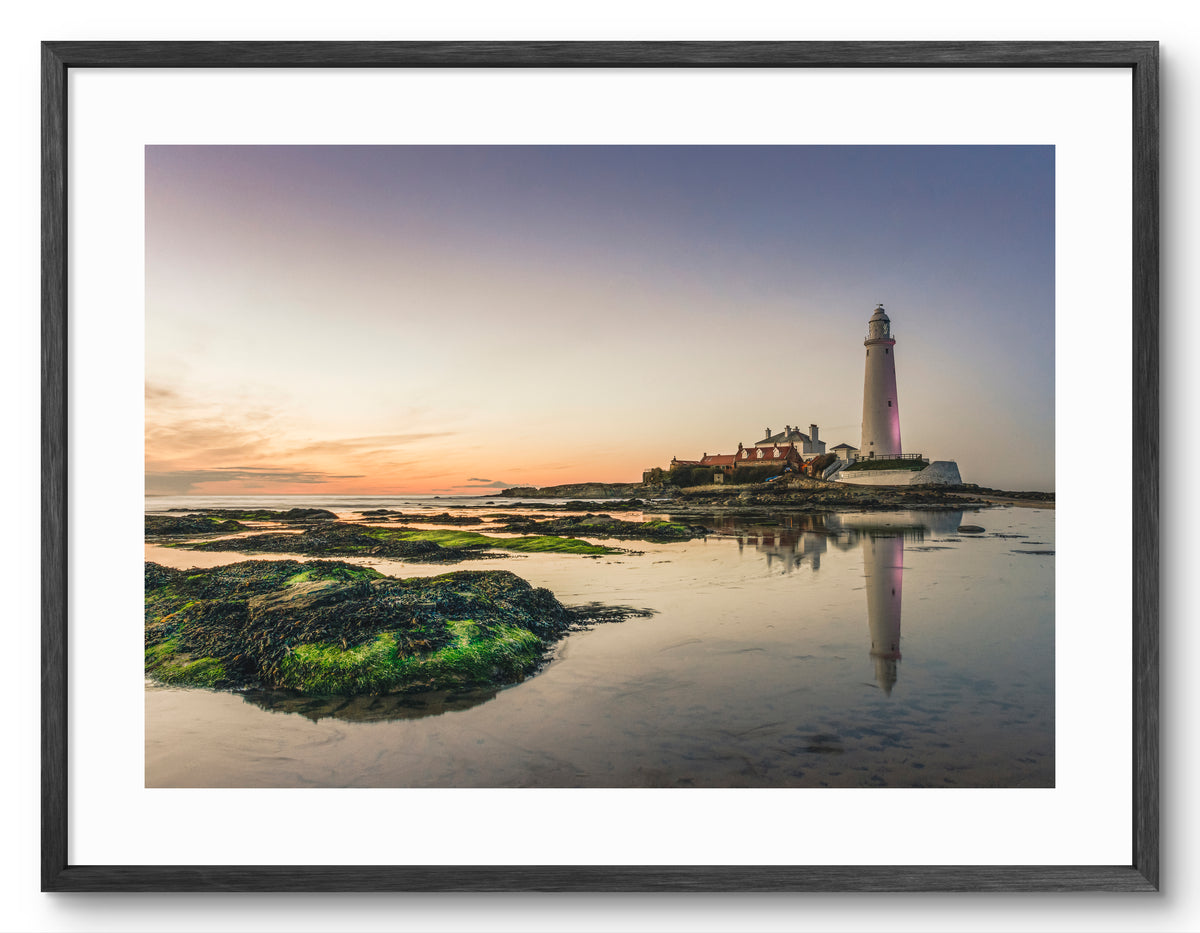 St Mary's Lighthouse - Seaweed Covered Rocks - Whitley Bay shown as a framed photographic print.