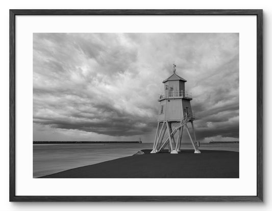 Herd Groyne Lighthouse Grey Skies - Black and White - South Shields shown as a framed photographic print.