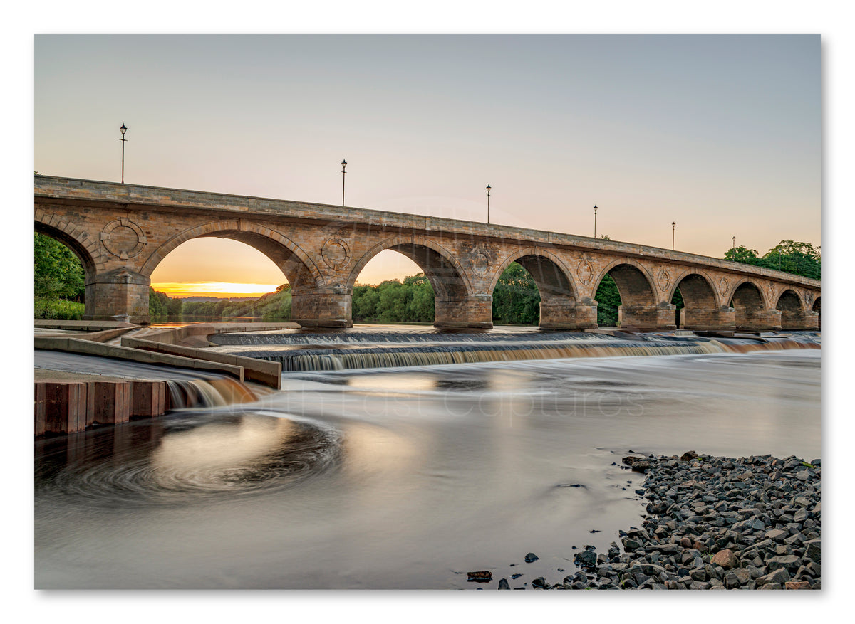 Hexham Bridge - Crossing The Tyne - Sunset through Arches - Hexham shown as a canvas print.