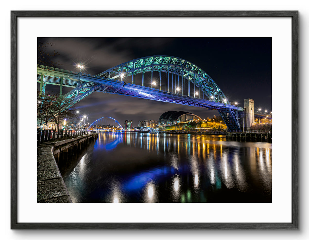 Tyne Bridge & Quayside at Night - River Tyne Reflections shown as a framed photographic print.