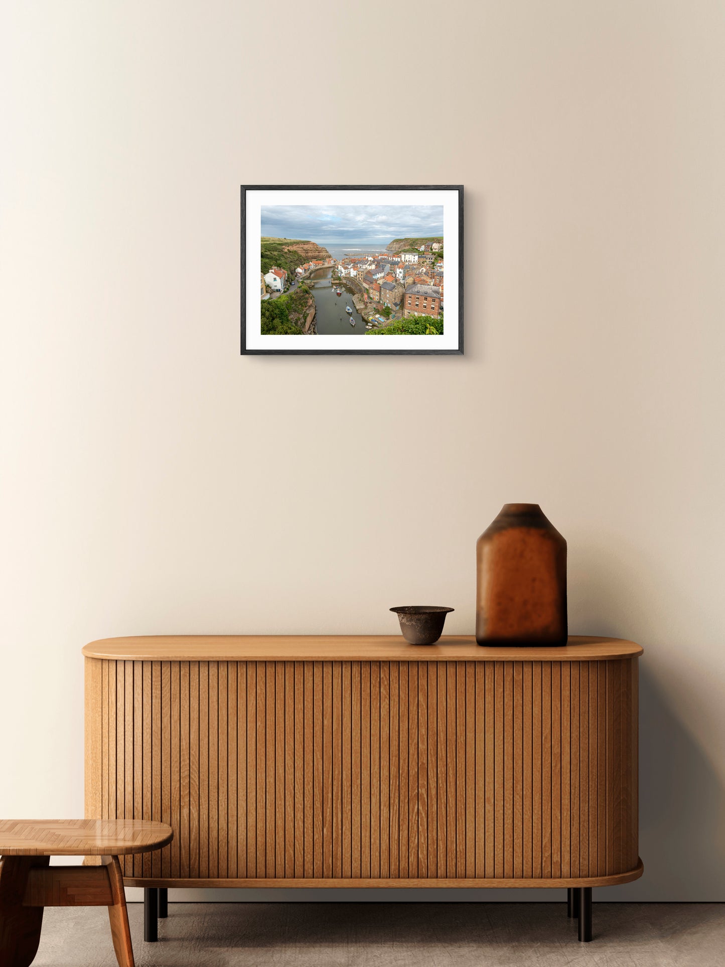 Staithes - Fishing Village - North Yorkshire wall art displayed in a styled room setting.