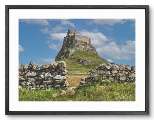 Lindisfarne Castle - Framed by Stone Wall on Holy Island - Northumberland shown as a framed photographic print.