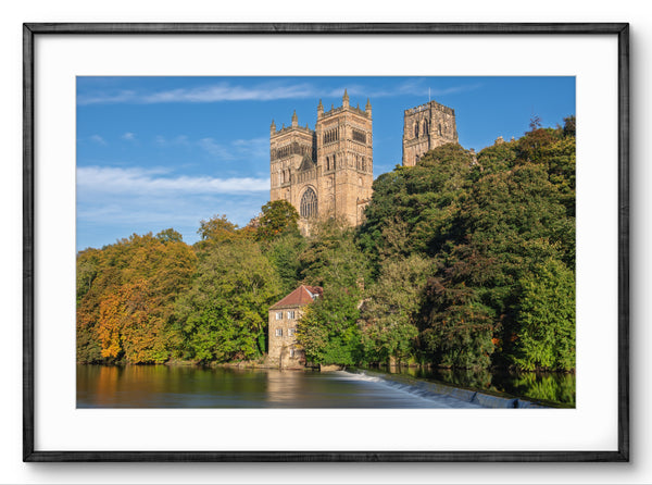 Framed photograph of a cathedral surrounded by trees and water