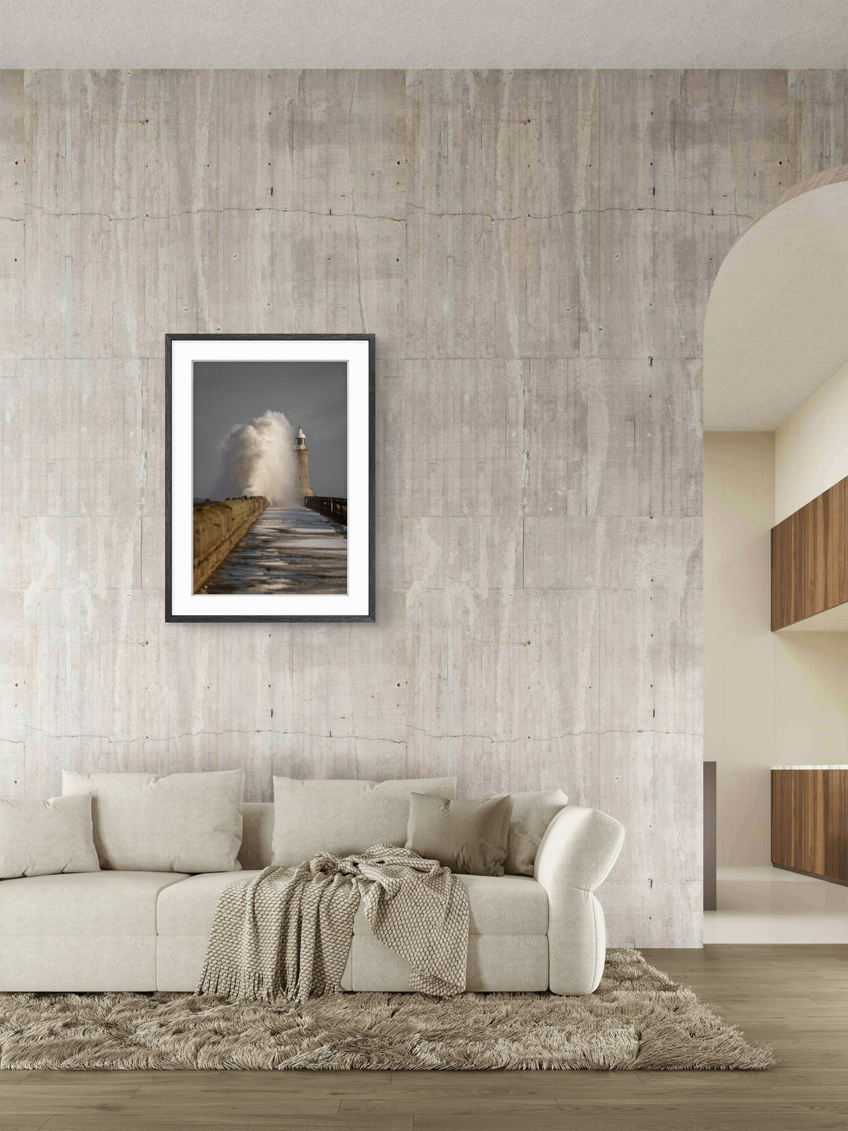 Framed artwork on a textured wall above a sofa in a modern living room.