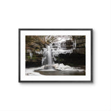 Framed photograph of a frozen waterfall with ice formations on a white background