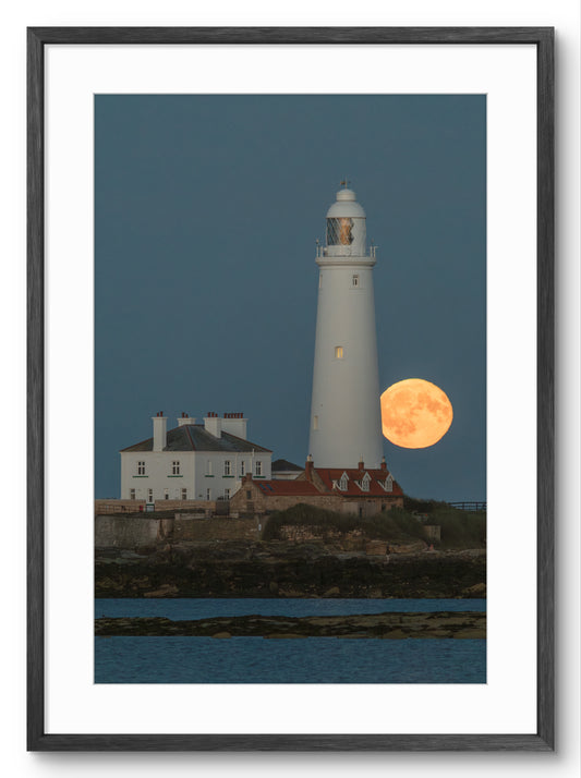 Lighthouse with a full moon in the background