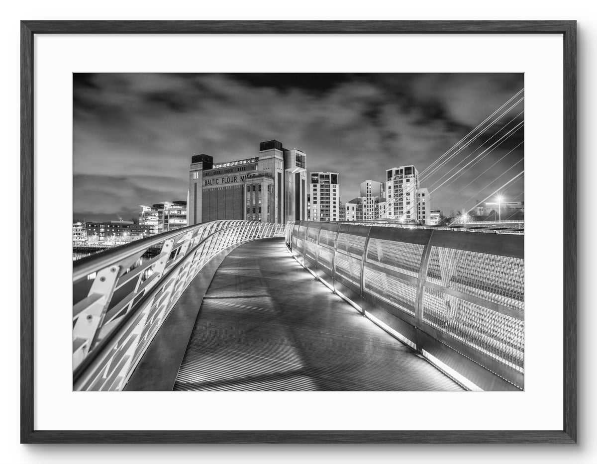 Black and white photograph of the Millennium Bridge and Baltic Arts Centre in Gateshead