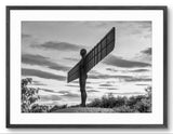 Black and white photograph of the Angel of the North sculpture against a cloudy sky.