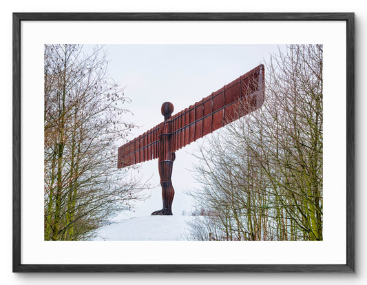 The Angel of the North - Snow - Gateshead shown as a framed photographic print.