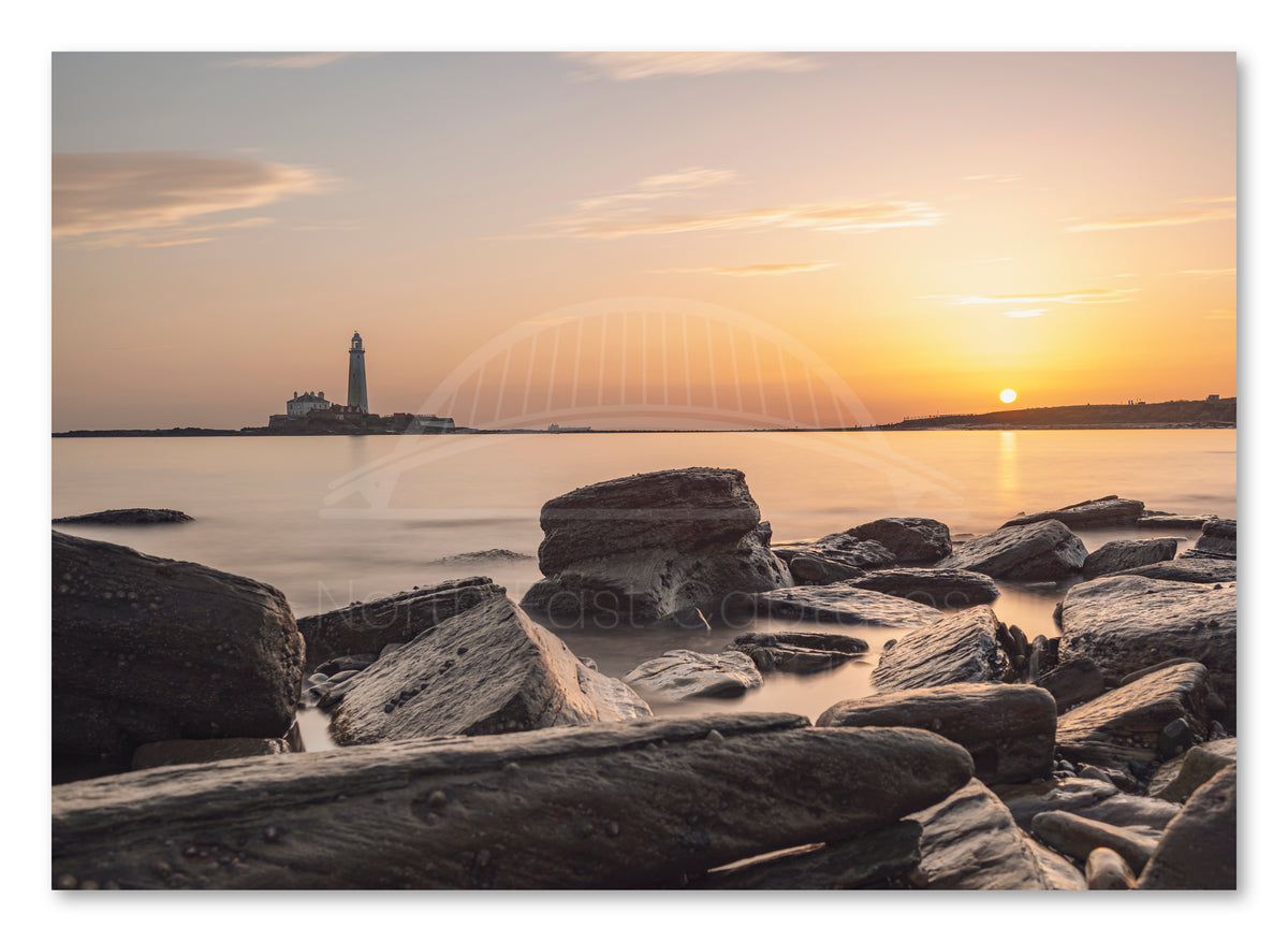 St Mary's Lighthouse and Rocks - Sunrise - Whitley Bay shown as a canvas print.