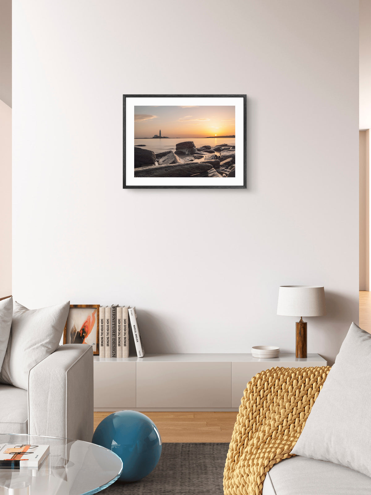 St Mary's Lighthouse and Rocks - Sunrise - Whitley Bay wall art displayed in a styled room setting.