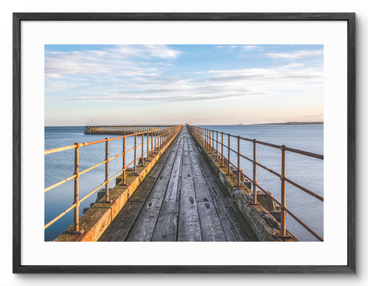 Blyth South Pier on the Northumberland coast shown as a framed photographic print.