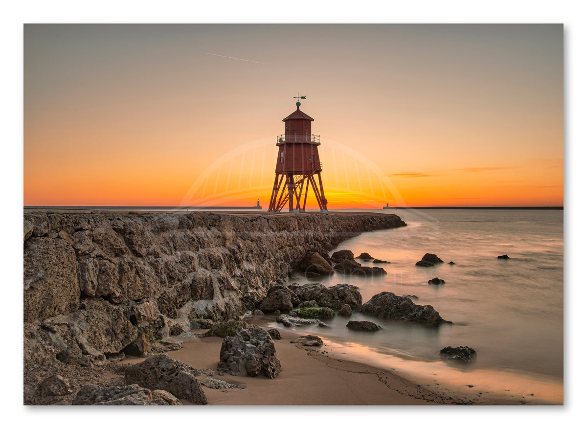Herd Groyne Lighthouse - Golden Sunrise - South Shield shown as a canvas print.
