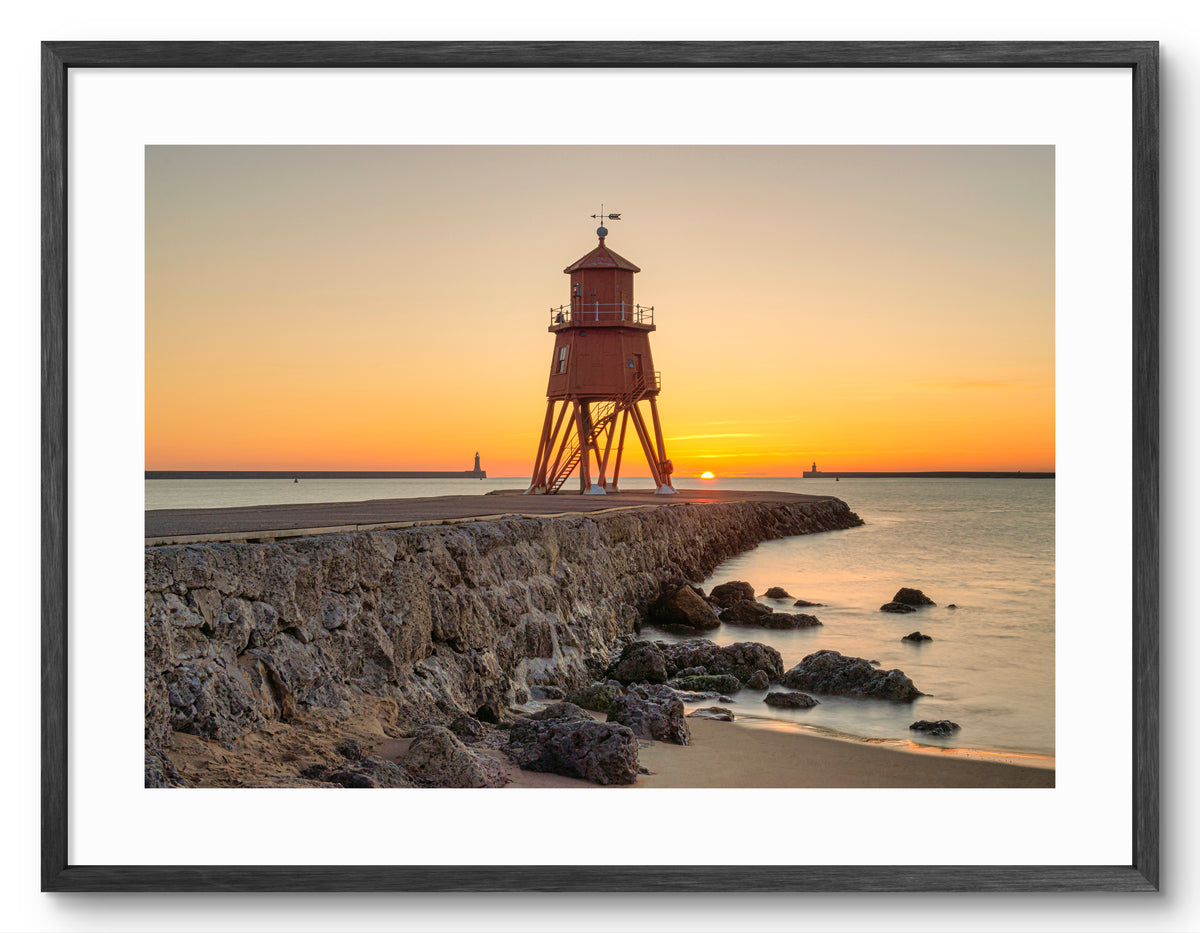 Herd Groyne Lighthouse - Sunrise - South Shield - South Tyneside shown as a framed photographic print.