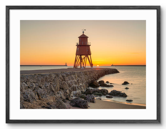 Herd Groyne Lighthouse - Sunrise - South Shield - South Tyneside shown as a framed photographic print.