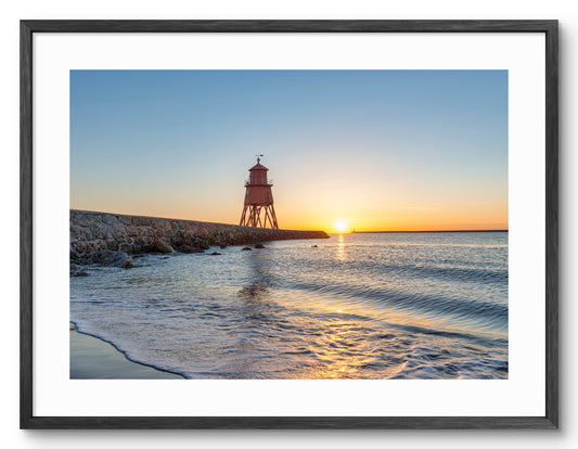 Herd Groyne Lighthouse - Sand Haven Beach Sunrise - South Shield shown as a framed photographic print.
