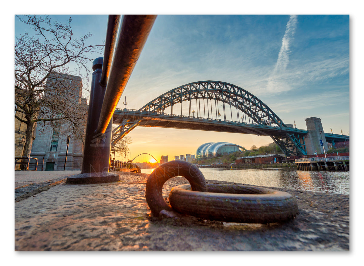 Quayside & Tyne Bridge Sunrise with Mooring Ring Print shown as a canvas print.