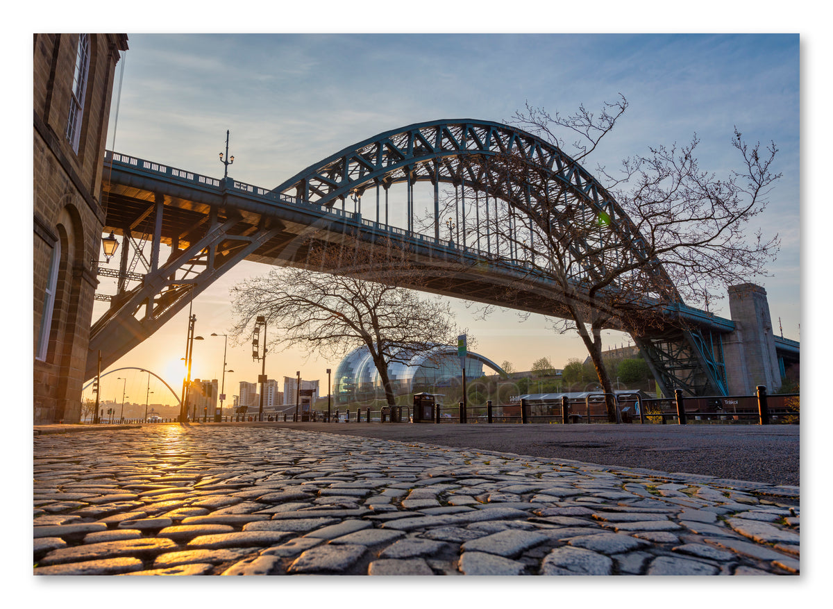 The Quayside - Cobbled Street at Sunrise - Newcastle shown as a canvas print.