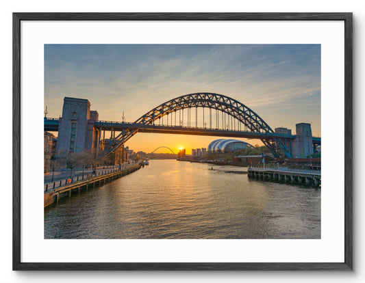 Tyne Bridge and River Tyne Sunrise - Newcastle - Gateshead shown as a framed photographic print.
