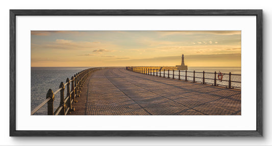 Roker Pier & Lighthouse at Sunrise panoramic print — black frame and white mount