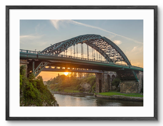 Wearmouth Bridge - The River Wear Sunset - Sunderland shown as a framed photographic print.