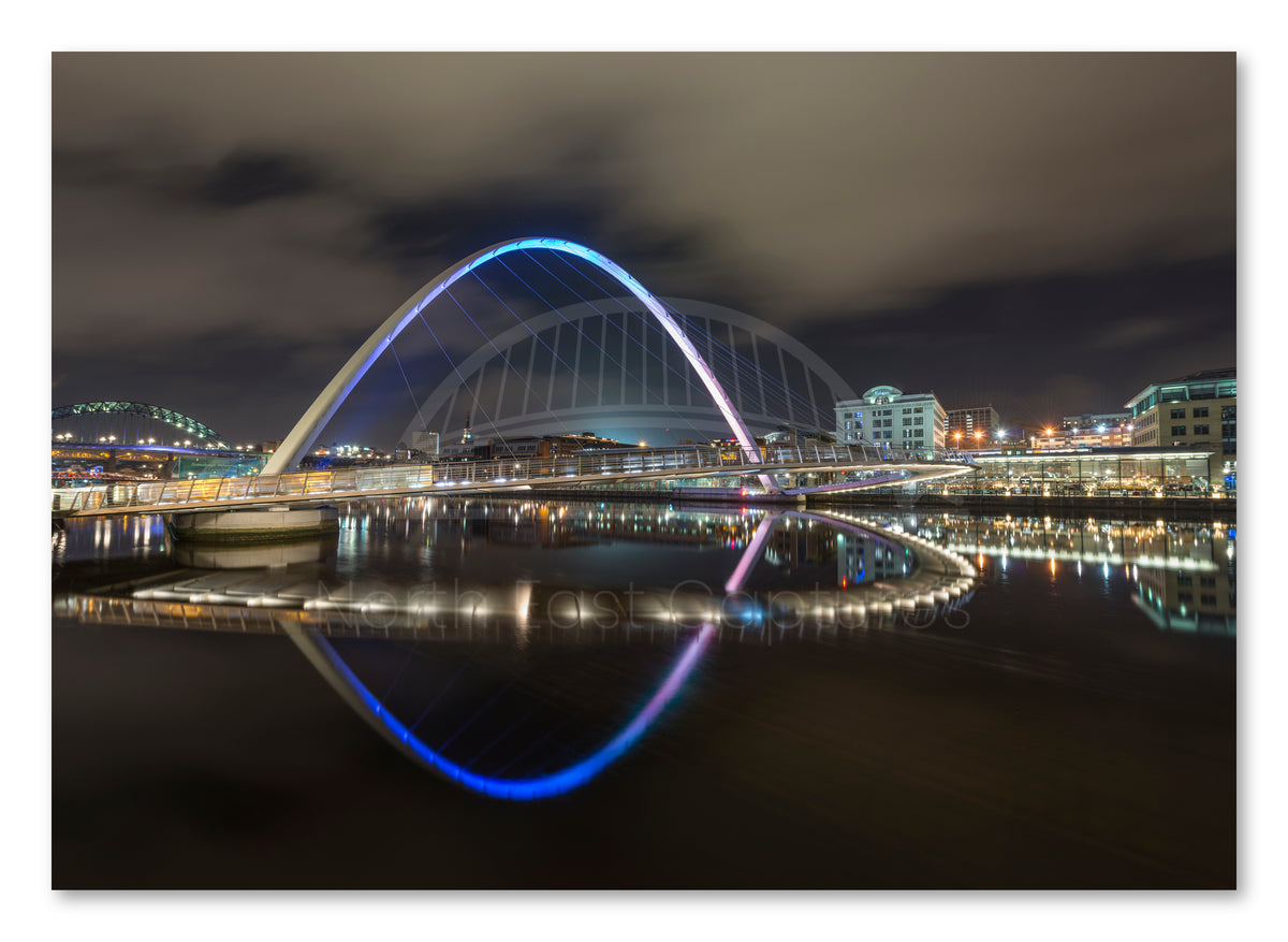 Millennium Bridge Gateshead - Reflecting on The River Tyne at Night - Newcastle shown as a canvas print.