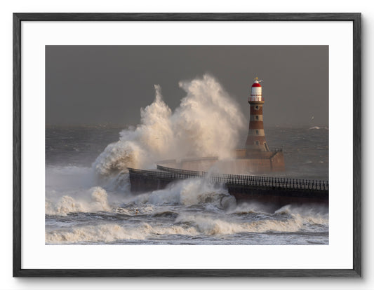 Roker Pier Lighthouse - Storm Arwen Waves - Sunderland shown as a framed photographic print.