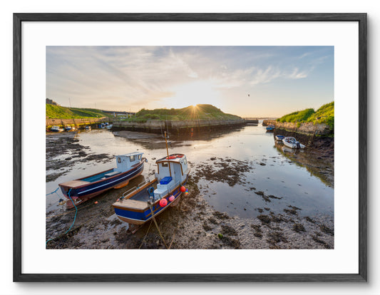 Boats in Seaton Sluice Harbour shown as a framed photographic print.