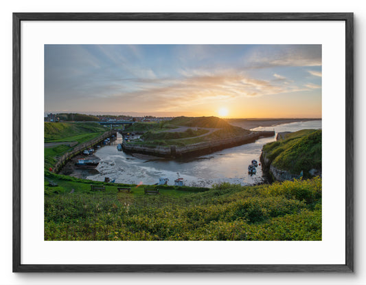 Seaton Sluice Harbour Sunset - Seaton Sluice - Northumberland shown as a framed photographic print.