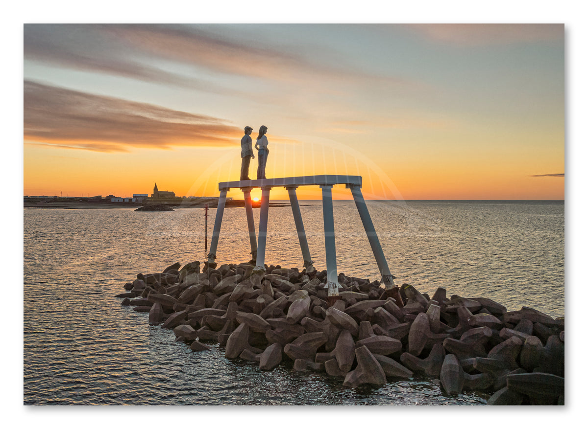 The Couple - Newbiggin By The Sea - Sunrise - Northumberland shown as a canvas print.