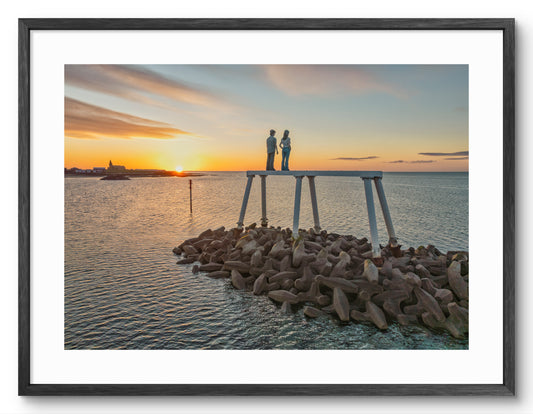 The Couple - Sculpture - Looking Out To Sea - Newbiggin By The Sea - Northumberland shown as a framed photographic print.