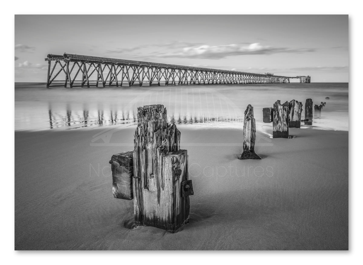 Steetley Pier and Wooden Groyne - Hartlepool - Black and White shown as a canvas print.