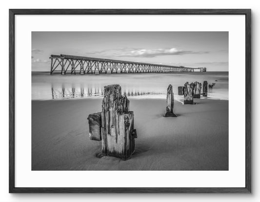 Steetley Pier and Wooden Groyne - Hartlepool - Black and White shown as a framed photographic print.