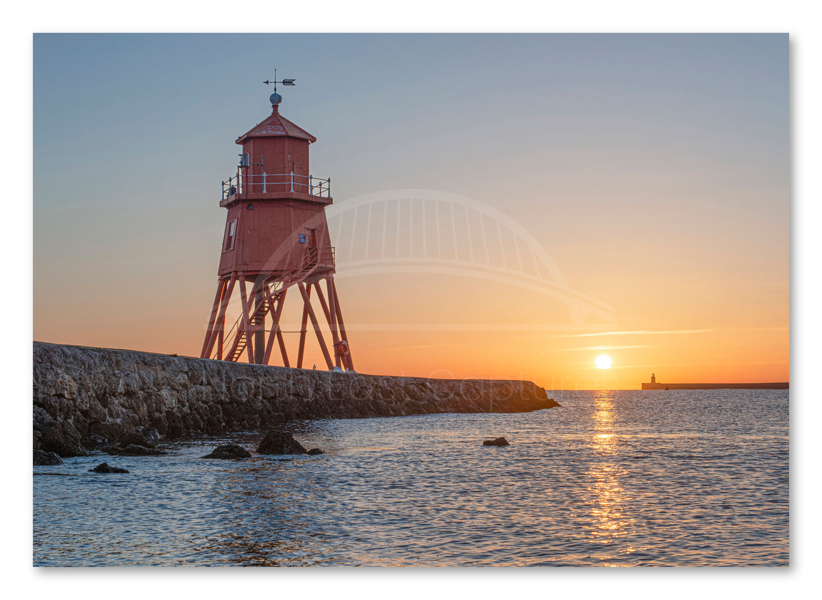 Herd Groyne Lighthouse - Sun reflecting on Sea - South Shields shown as a canvas print.