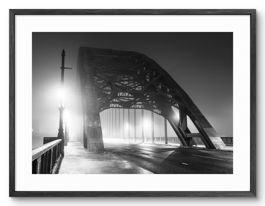 Fog on the Tyne Bridge Newcastle - Black & White shown as a framed photographic print.