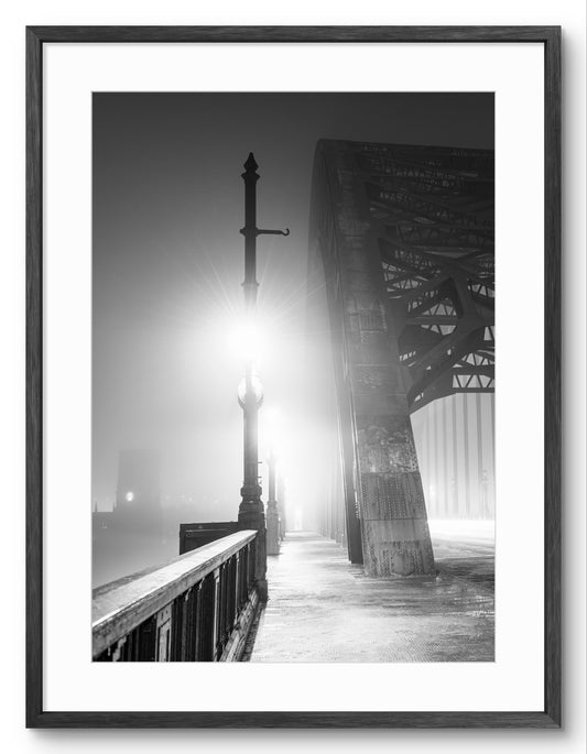 Fog on the Tyne Bridge - Newcastle - Black and White shown as a framed photographic print.