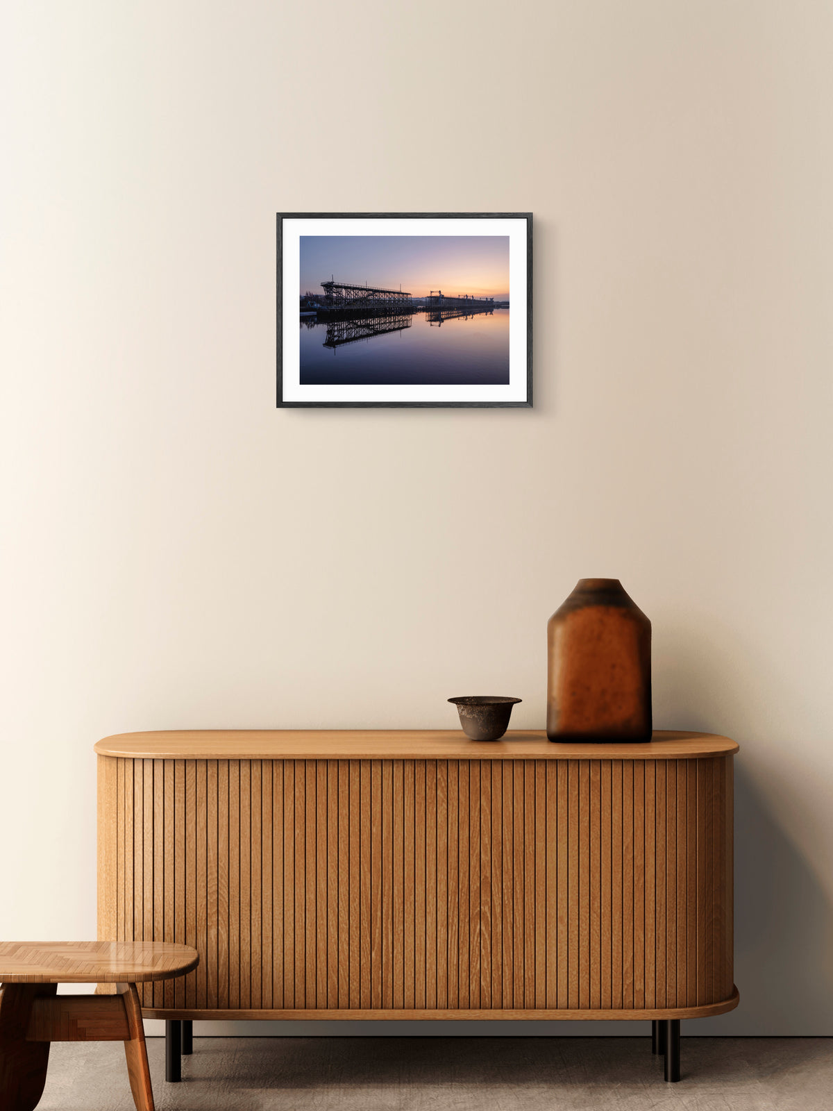 Dunston Staiths reflected in the River Tyne at sunset wall art displayed in a styled room setting.