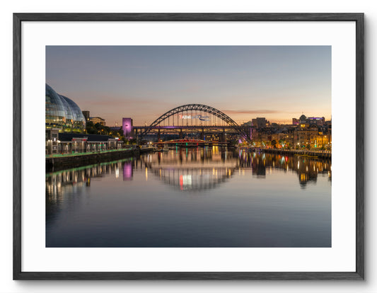Tyne Bridge and Quayside - Reflecting on The River Tyne - Newcastle - Gateshead shown as a framed photographic print.