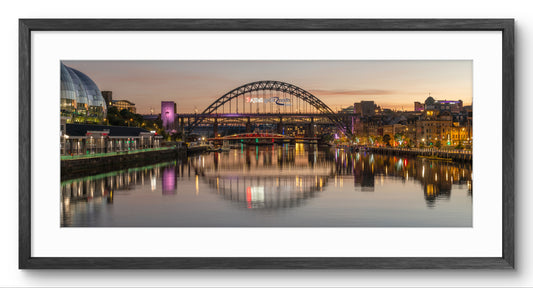 Newcastle Quayside & Tyne Bridge Sunset panoramic print — black frame and white mount