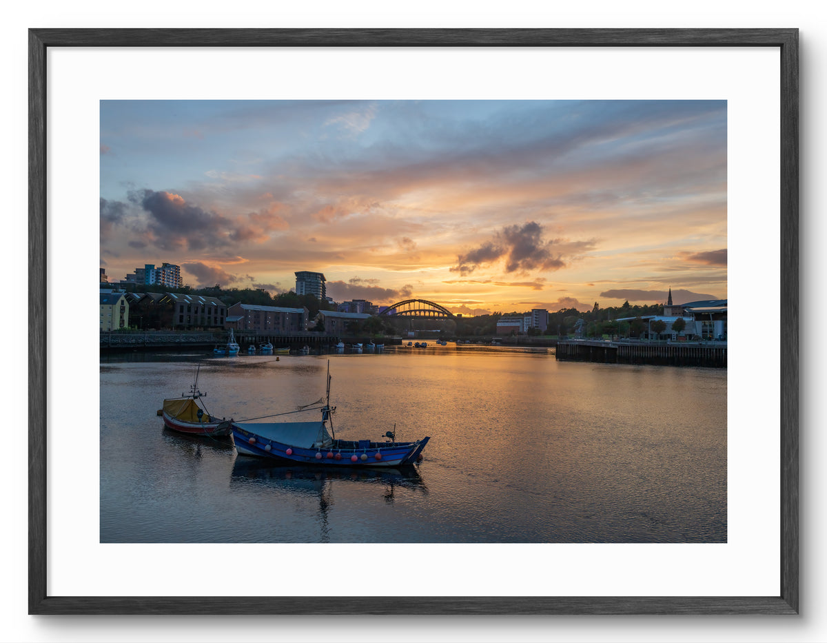 Wearmouth Bridge - Boats on the Wear - Sunset - Sunderland shown as a framed photographic print.