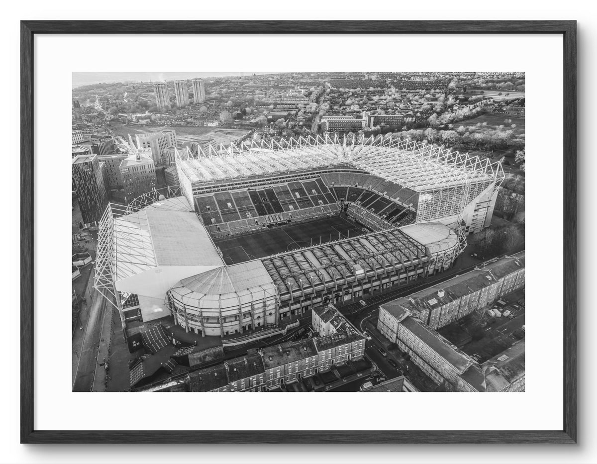 St James Park - Home of Newcastle United - Black and White shown as a framed photographic print.