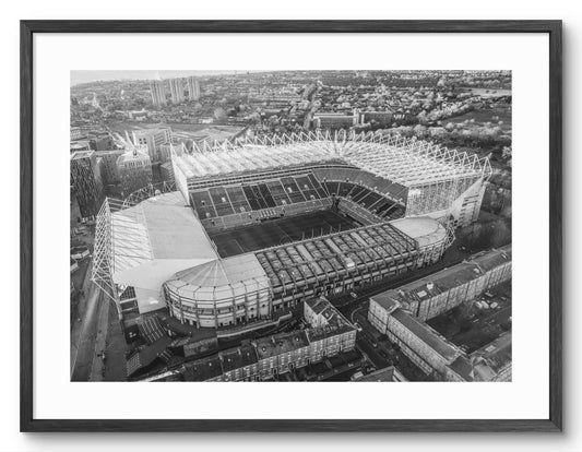 St James Park - Home of Newcastle United - Black and White shown as a framed photographic print.