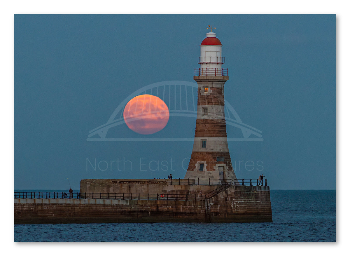 Roker Pier Lighthouse - Harvest Moon - Sunderland shown as a canvas print.
