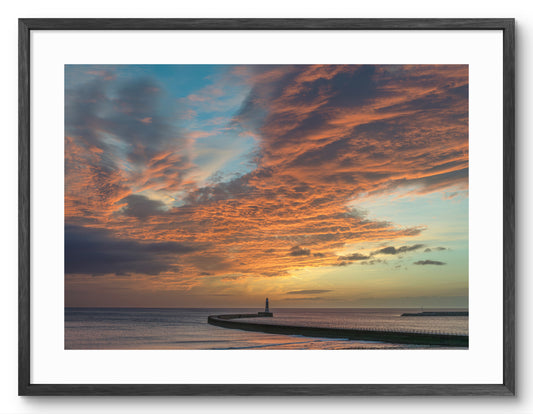 Roker Beach and Pier - Sunrise Clouds - Sunderland shown as a framed photographic print.
